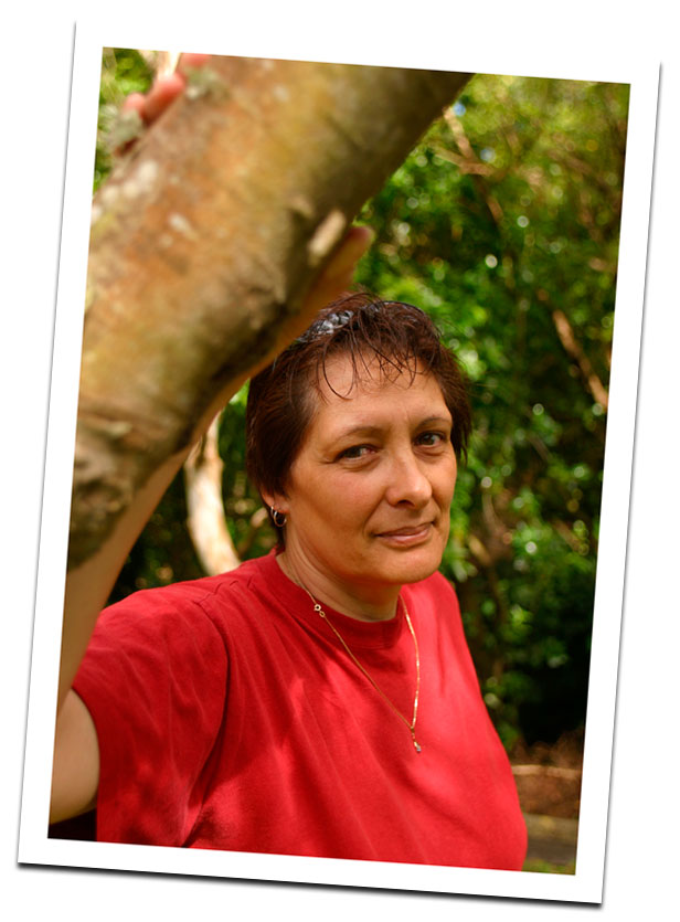 Woman standing by tree Woman standing by tree