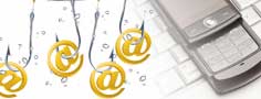 A mobile phone sitting on top of a computer keyboard. "@" symbols hooked onto fishing hooks representing online phishing, a common Internet scam.