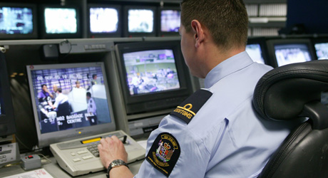 Customs officer inspects video footage
