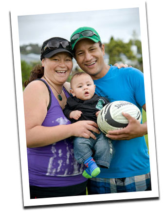 woman and man with baby and ball