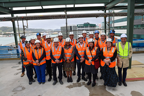 Representatives from Dexus, LT McGuinness, Ngā Taonga Sound & Vision and DIA (Archives NZ, National Library, Te Ara Tahi programme) celebrate the topping out of the new archival building.  Credit: Max Olijnyk/Te Tari Taiwhenua