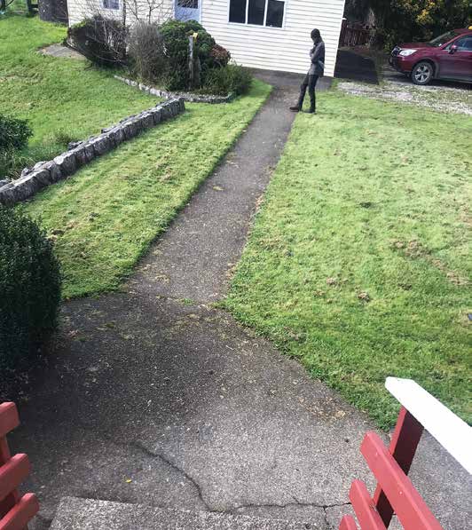 Suspected sighting of Tom Phillips. Image showing man in full balaclava from a distance in a garden. Suspected sighting of Tom Phillips. Image showing man in full balaclava from a distance in a garden.